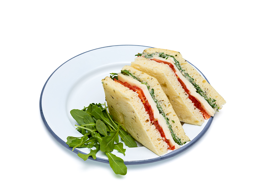 Mini sandwiches on plates: Ciabatta, croissants, wraps, sandwiches